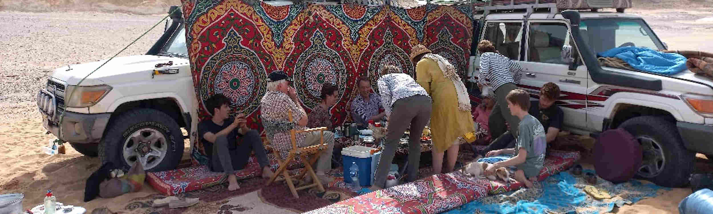 Group enjoying a meal in the desert